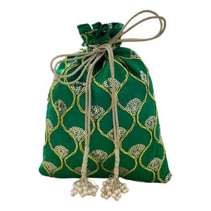 May include: A green drawstring pouch with gold embroidery and sequin accents. The bag features a repeating floral pattern and a gold drawstring closure with white beaded tassels. The pouch is made of a shiny fabric.
