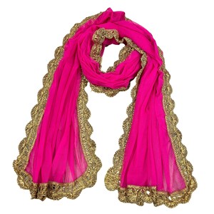 May include: A pink sheer scarf with a gold embroidered border. The border has a scalloped edge.