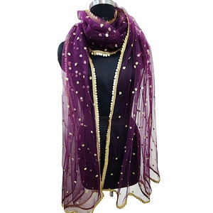 May include: A purple net dupatta with gold sequins and a gold border. The dupatta is draped over a mannequin.