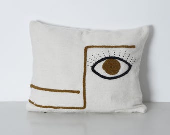 Embroidered Eye Pillow Cover – Handwoven Moroccan Wool Cushion 24x18” – Boho Surrealist Decor – Cream Throw Pillow with Artisan Design