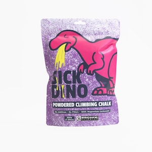 May include: Purple bag of powdered climbing chalk with a pink dinosaur graphic that says "Sick Dino" and "100% Magnesium Carbonate". The bag is 7.05 ounces.