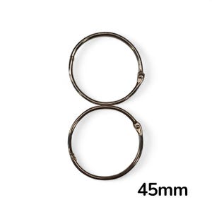 May include: Two silver binder rings with hinged openings are shown against a white backdrop. The rings are linked, and the text "45mm" is visible, indicating the diameter of the rings. This is approximately 1.77 inches.