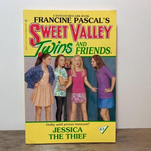 May include: A paperback book titled "Sweet Valley Twins and Friends" by Francine Pascal. The cover features four girls and the text "Jessica the Thief". The book has a yellow background with red and green text.
