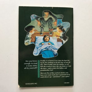 May include: A book cover with a green background and a picture of a boy in bed with a scary story being told to him by three people. The text on the cover reads "Are you brave enough to read a scary story all by yourself?" and "Freddy is so bored. Ever since he hurt his leg he has nothing to do but stay in bed all day. Then Freddy asks his mother to tell him the scariest story she can think of. And she does and so does his father, and grandmother too! Here are five of the scariest stories you have ever read. Each one is guaranteed to send shivers up-and down your spine!"