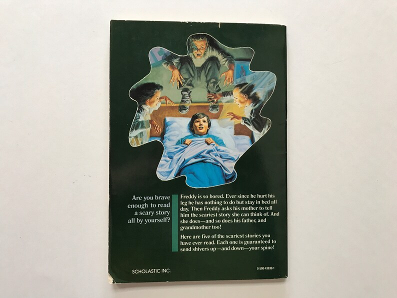 May include: A book cover with a green background and a picture of a boy in bed with a scary story being told to him by three people. The text on the cover reads "Are you brave enough to read a scary story all by yourself?" and "Freddy is so bored. Ever since he hurt his leg he has nothing to do but stay in bed all day. Then Freddy asks his mother to tell him the scariest story she can think of. And she does and so does his father, and grandmother too! Here are five of the scariest stories you have ever read. Each one is guaranteed to send shivers up-and down your spine!"
