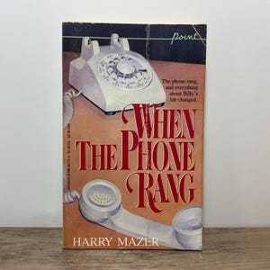 May include: A vintage paperback book titled "When The Phone Rang" by Harry Mazer. The cover shows a white rotary phone and handset on a brown background. The title is in large, red, stylized letters.