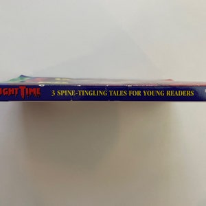 May include: A blue book with the title "Fright Time" and the text "3 Spine-Tingling Tales for Young Readers" in yellow. The book is published by Baronet Books.