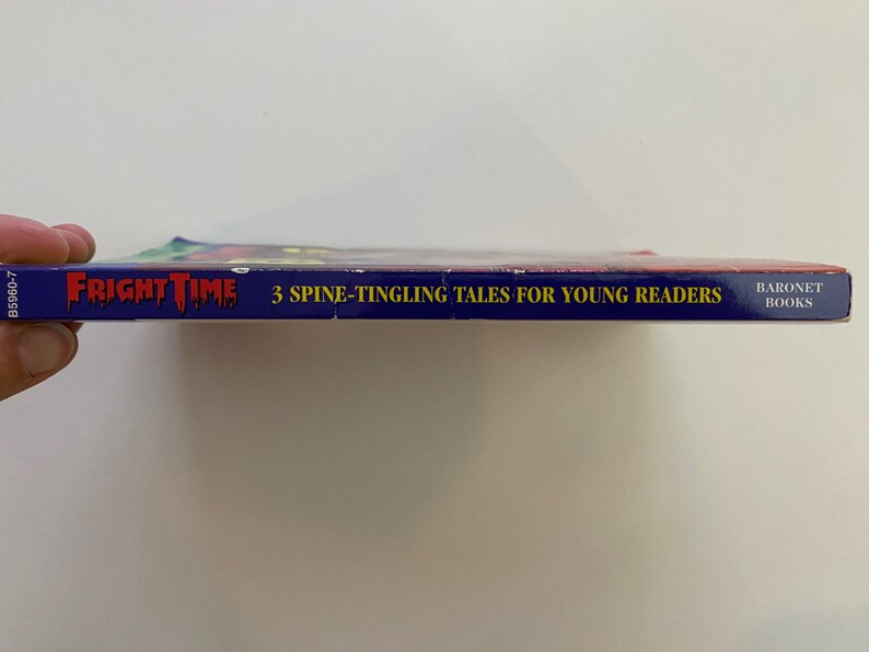 May include: A blue book with the title "Fright Time" and the text "3 Spine-Tingling Tales for Young Readers" in yellow. The book is published by Baronet Books.