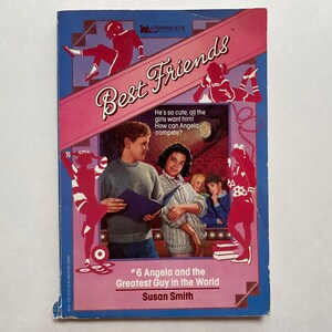 May include: A vintage paperback book titled "Best Friends" with a pink banner and blue background. The cover features illustrations of young people and the text "#6 Angela and the Greatest Guy in the World" by Susan Smith.