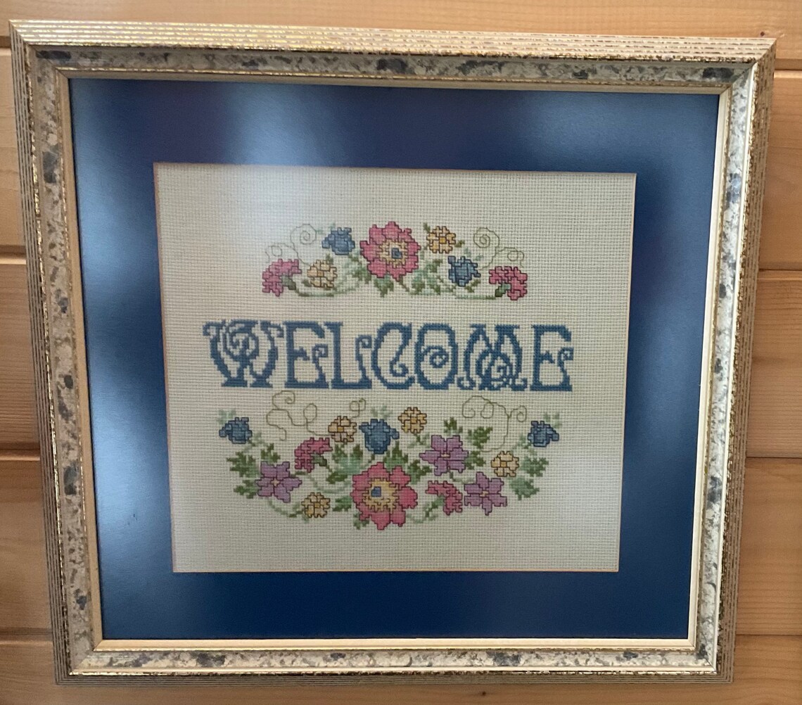 Cross stitched framed with non reflective glass. Etsy