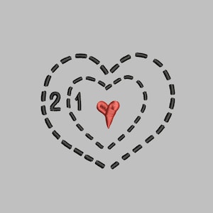 May include: A black stitched heart with two smaller hearts inside. The smallest heart is red and the two larger hearts are outlined in black. The number '21' is stitched inside the largest heart.