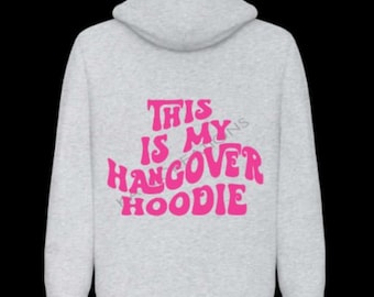 May include: A gray hooded sweatshirt with the text "This is my hangover hoodie" in pink.