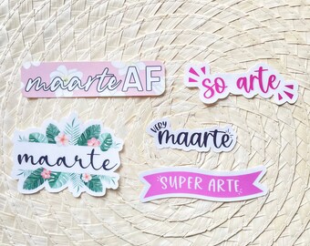 May include: Five pink and white stickers with the word "maarte" and the phrases "so arte", "very maarte", "maarte AF", and "super arte".