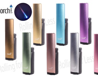 May include: A collection of eight Scorch torch lighters in various metallic colors, including gold, green, rose, silver, blue, and purple. Each lighter has a black base and the Scorch logo. A blue flame is shown in a circular graphic.