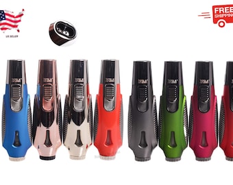 May include: A collection of seven Tesla brand lighters in various colors, including blue, rose gold, silver, red, gray, green, and pink. Each lighter has a black top and a textured grip.