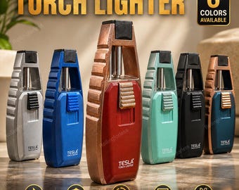 May include: Six Tesla torch lighters in silver, blue, red, light green, black, and dark blue. Each lighter features a vertical ignition button, a metallic frame, and the text "TESLA TORCH LIGHTER" printed on the front. The image includes text stating "TORCH LIGHTER" and "6 COLORS AVAILABLE" along with icons for flame, windproof, butane, pocket size, and gift.