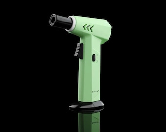 May include: A green butane torch lighter with a black nozzle and a black handle. The lighter has a black button on the side and the word "MAVEN" printed on the handle.