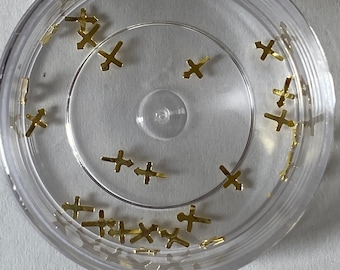 Gold cross tooth gems