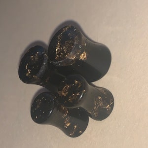 Gauges / plugs - Black with gold flakes