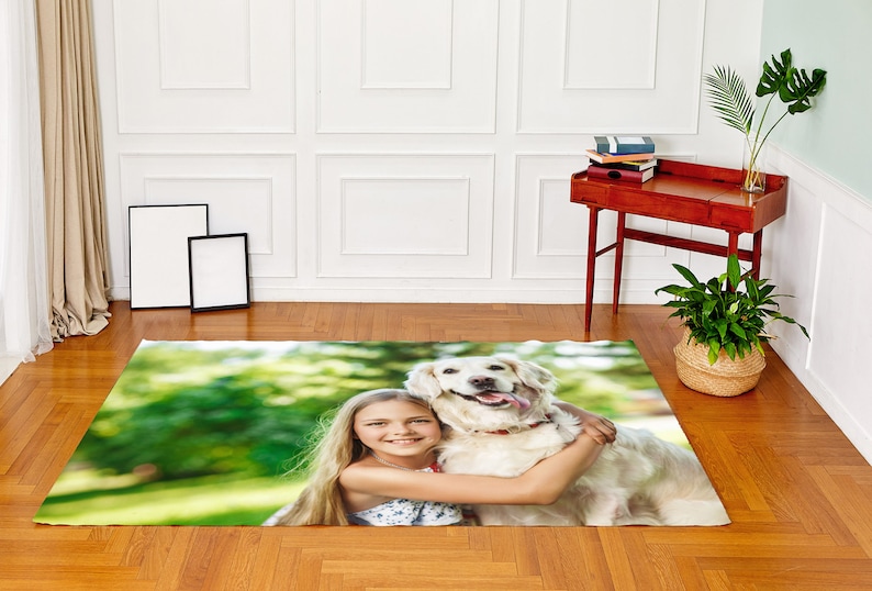 May include: A girl hugs a white dog in a green grassy field. The girl has long blonde hair and is wearing a white tank top. The dog has a black collar and is looking at the camera.