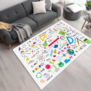 May include: White play rug with colorful illustrations of science and math subjects, including chemistry, physics, biology, geography, music, and art. The rug features words like "Think & Wonder", "Learning", "Fun", "Smart", and "Cool".