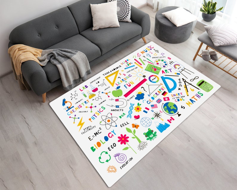 May include: White play rug with colorful illustrations of science and math subjects, including chemistry, physics, biology, geography, music, and art. The rug features words like "Think & Wonder", "Learning", "Fun", "Smart", and "Cool".