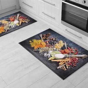 May include: Two kitchen rugs with a black background and a colorful design of various spices, herbs, and spoons.