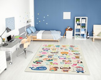 May include: A beige alphabet rug with colorful cartoon animals and letters in a child's bedroom. The rug features a whale, zebra, and other animals. The room has a bed, desk, and a white bookshelf.