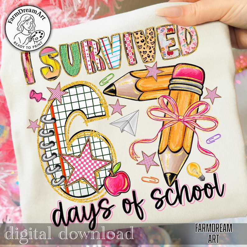May include: Cream-colored t-shirt with the text "I Survived 6 days of school" in colorful, glittery lettering. Features pencil and star graphics, a red apple, and a paper airplane. "FarmDreamArt" logo is visible.