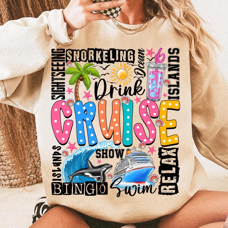 May include: Beige sweatshirt with a colorful graphic design that says "Drink Cruise" with images of a palm tree, a cruise ship, a dolphin, a wave, and a cocktail. The graphic also includes the words "Snorkeling", "Ocean", "Relax", "Islands", "Bingo", "Swim", "Show", and "Sightseeing".