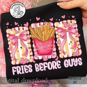 Op de afbeelding: Zwart sweatshirt met een grafisch ontwerp met een roze bakje friet, roze strikken en hartjes. De tekst "FRIES BEFORE GUYS" is weergegeven in roze en wit. De woorden "digital download" zijn ook zichtbaar.