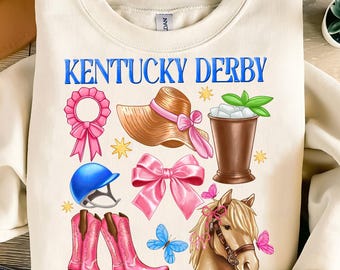 May include: A cream-colored sweatshirt with the text "Kentucky Derby" in blue lettering. The sweatshirt features a variety of colorful illustrations, including a blue riding helmet, pink cowboy boots, a pink bow, a brown hat, a mint julep, and a brown horse head.