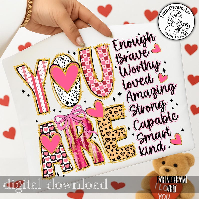 May include: A digital download featuring the words "YOU ARE" in a decorative font with pink hearts and gold accents. The words "Enough, Brave, Worthy, Loved, Amazing, Strong, Capable, Smart, Kind" are also displayed. A pink bow and hearts are also present.