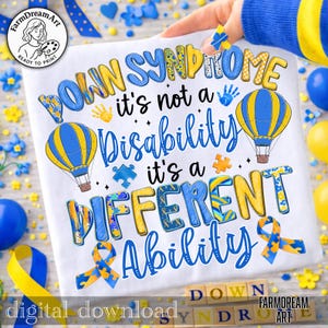 May include: White t-shirt with the text "DOWN SYNDROME it's not a Disability it's a DIFFERENT Ability". The design includes hot air balloons, puzzle pieces, and ribbons in blue and yellow. The words "digital download" are also visible.