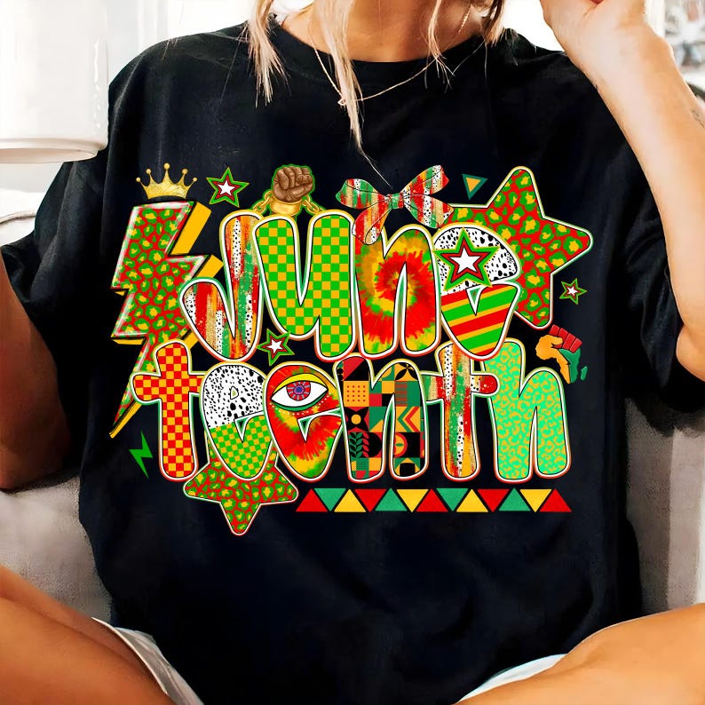 May include: Black t-shirt with a colorful "June Tenth" graphic. The design features a crown, stars, and various patterns in red, green, yellow, and black. The text is in a bold, multi-textured style.