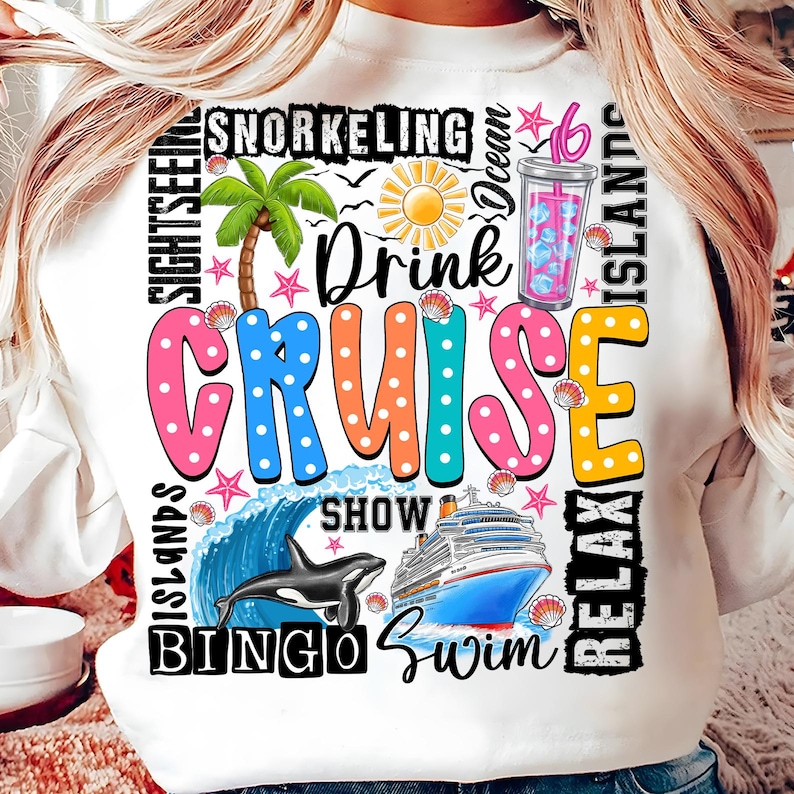 May include: White sweatshirt with a colorful graphic design that says "Drink Cruise" with images of a cruise ship, a dolphin, a palm tree, a drink, and other cruise-related icons.