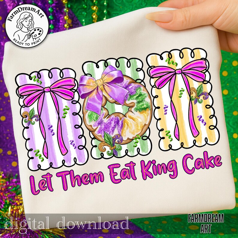May include: A white fabric item with a vibrant design that reads "Let Them Eat King Cake." The design includes images of King Cake and bows in purple, yellow, and green. The words "digital download" are also visible.