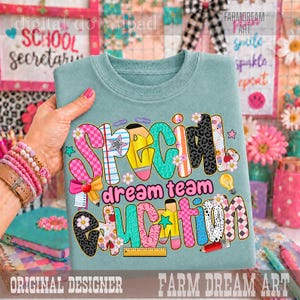 May include: A dusty blue crewneck sweatshirt featuring the text Special Education in large, colorful, patterned bubble letters. The design includes school-themed graphics like pencils, rulers, and paper clips, with pink, yellow, and teal accents.
