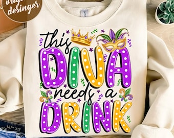 May include: A white sweatshirt with a purple, green, and yellow design that says "This Diva Needs a Drink". The design features polka dots, a crown, and a jester's hat.
