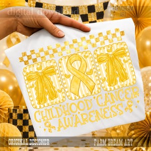 May include: A white t-shirt featuring a gold-colored graphic with a checkered border, two bows, and a central awareness ribbon. The text reads CHILDHOOD CANCER AWARENESS in a bold, yellow font, accompanied by small ribbon icons and heart shapes.