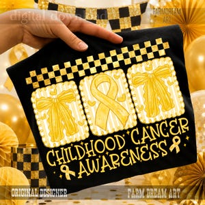 May include: A black t-shirt featuring a gold checkered border and three rectangular frames with gold striped backgrounds. The frames contain gold bows and a gold awareness ribbon. The text reads CHILDHOOD CANCER AWARENESS in gold.