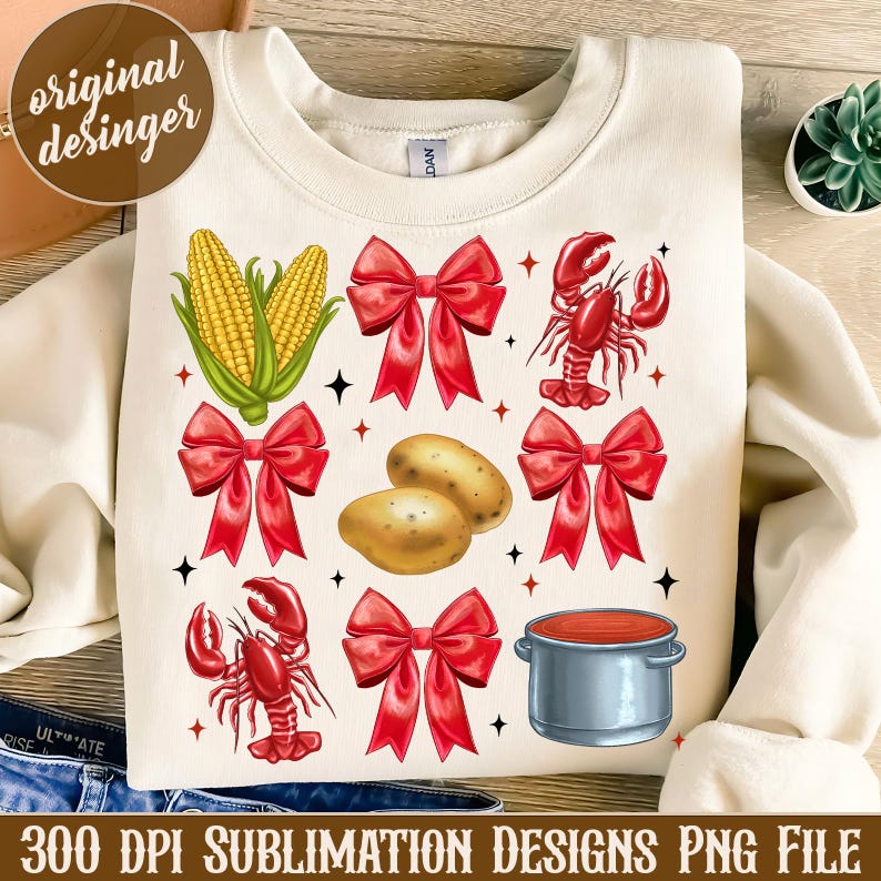 K&ouml;nnte beinhalten: Ein Sublimationsdesign mit wei&szlig;em Hintergrund, roten Schleifen, Maiskolben, Hummern, Kartoffeln und einem roten Topf mit grauem Deckel. Das Design ist perfekt f&uuml;r die Erstellung von individueller Kleidung, Tassen, Tragetaschen und anderen Artikeln.