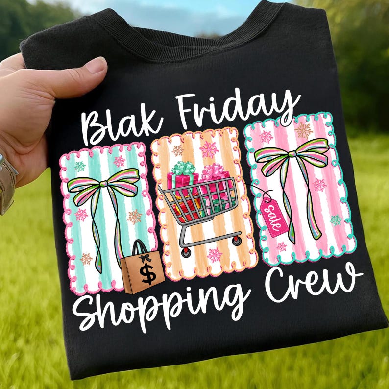 May include: Black t-shirt with the words "Blak Friday Shopping Crew" in white script. The shirt features three colorful rectangular designs with bows, stripes, and shopping-themed graphics, including a shopping cart and gift boxes.