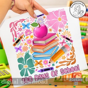 May include: White t-shirt with a colorful graphic design featuring an apple, books, a pencil, crayons, butterflies, and flowers. The text "100 Days Of School" is displayed in pink. The design is a digital download.