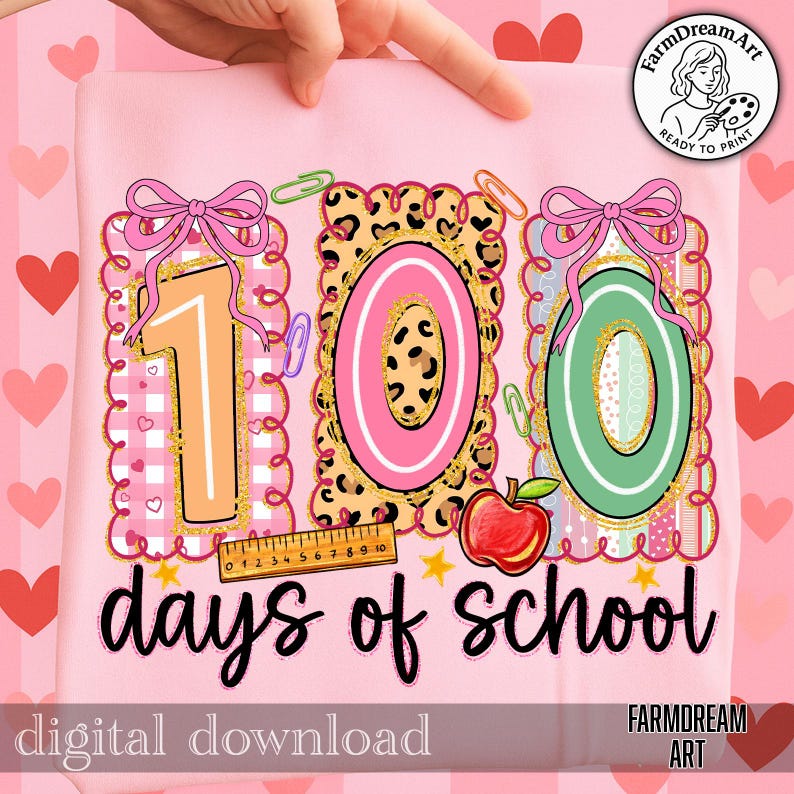 May include: Pink graphic tee with the text "100 days of school." The design features the numbers 1, 0, and 0 in a colourful, decorative style with a ruler, apple, and paperclips. The words "digital download" are also present.