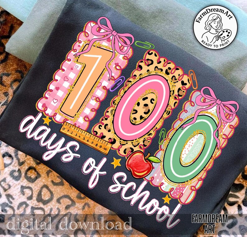 May include: A dark grey t-shirt with a vibrant graphic celebrating "100 days of school." The design incorporates the numbers "100" in diverse patterns, a ruler, an apple, and the words "days of school" in a script font. The words "digital download" are also present.