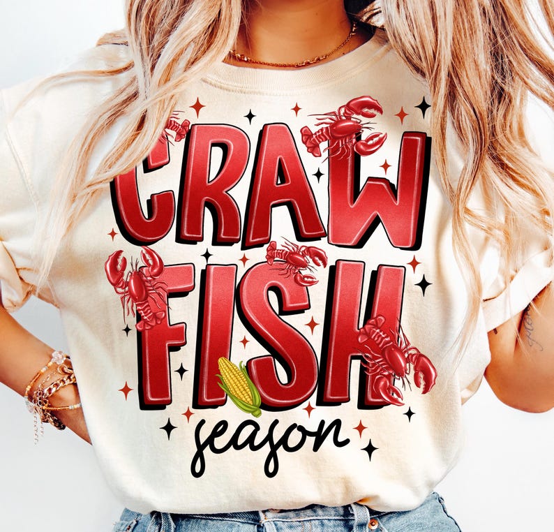 May include: A white t-shirt with red text that says "Crawfish season" with illustrations of crawfish and corn.