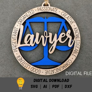 May include: A wooden ornament with a blue scale of justice design and the word "Lawyer" in a cursive font. The ornament is surrounded by a circle of text that reads "Organized - Passionate - Creative - Knowledgeable - Good Listener - Communicative -  Perseverant".