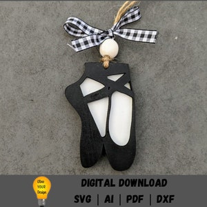 Puede incluir: Adorno de madera de bailarina negra con una cinta a cuadros blancos y una cuenta blanca. DESCARGA DIGITAL SVG AI PDF DXF