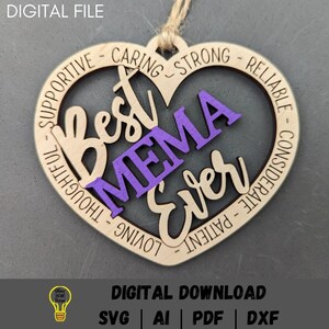 May include: A wooden heart-shaped ornament with the words "Best Mema Ever" in purple and white lettering. The words "Supportive, Caring, Strong, Reliable, Thoughtful, Loving, Considerate, Patient" are written around the edge of the heart.
